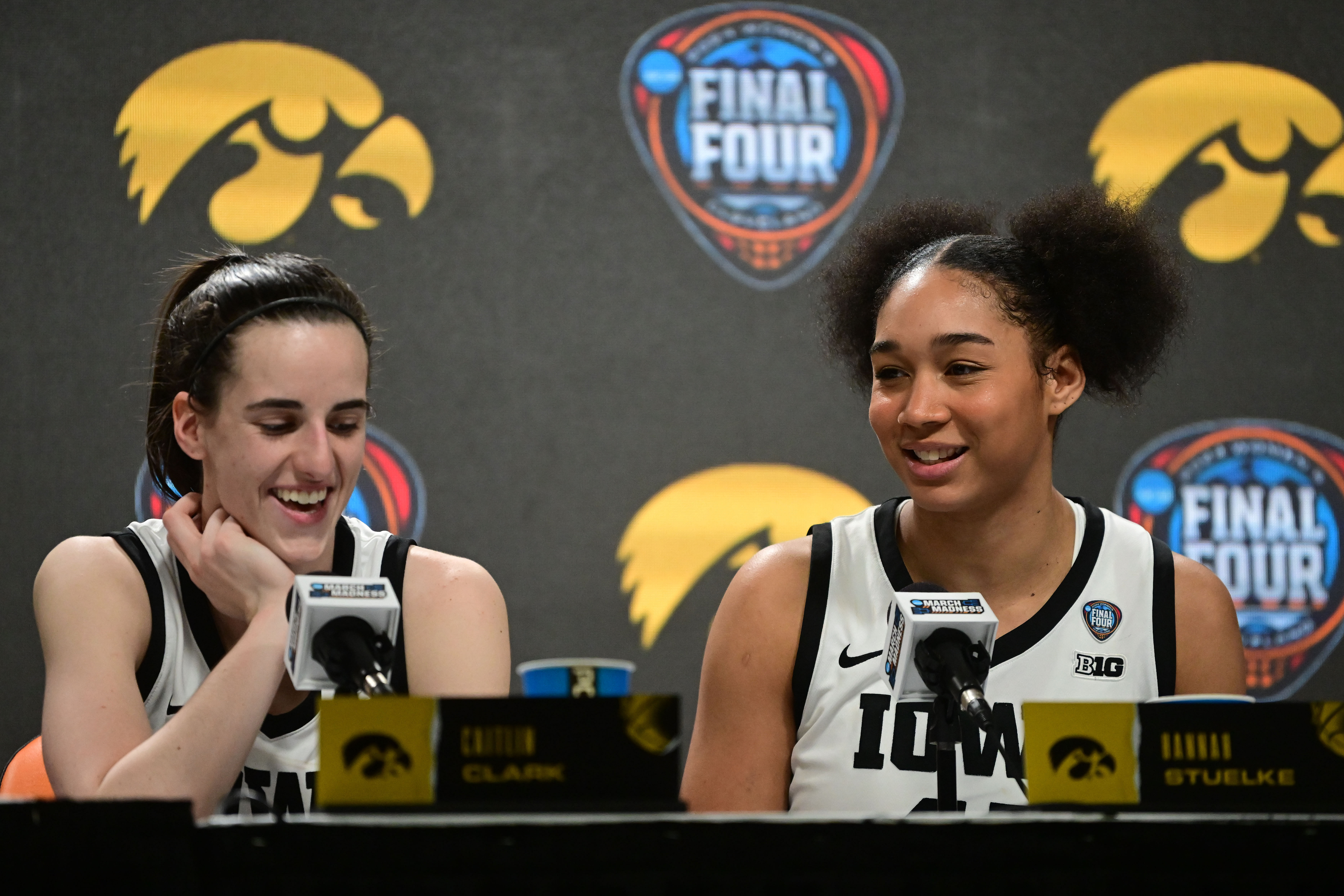 Iowa Hawkeyes guard Caitlin Clark (left) and forward Hannah Stuelke (right) speak to the media after defeating the Connecticut Huskies in the Final Four of the 2024 NCAA Tournament (Credits: IMAGN) Caitlin